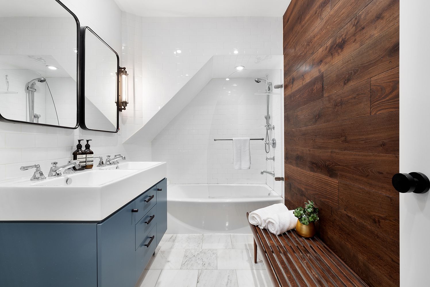 258 West 93rd Street, Unit 4AB Manhattan, NY 10025 - Photo 7 of 10 a bathroom with a bathtub sink and mirror