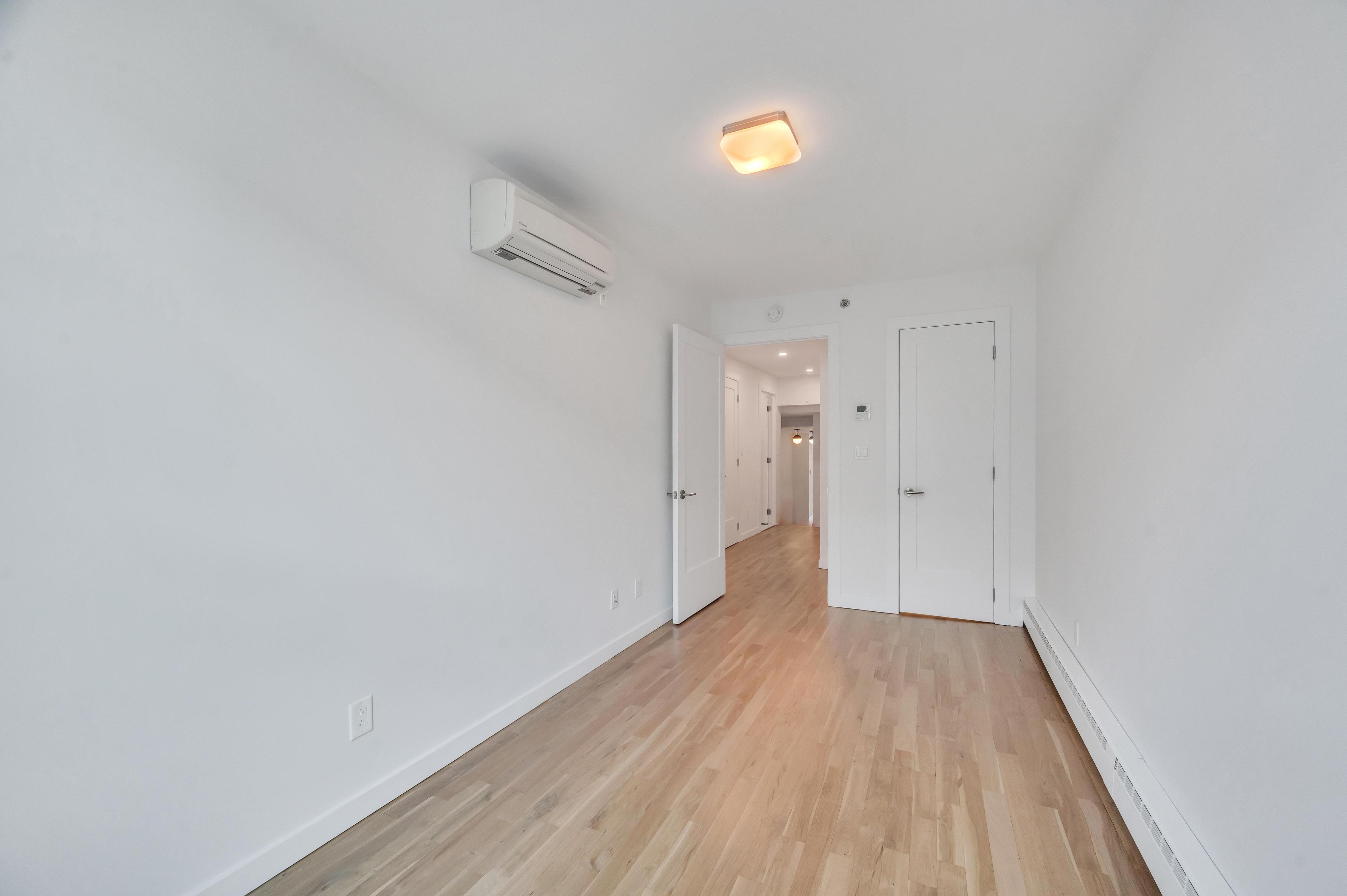717 Manhattan Avenue, Unit 3A Brooklyn, NY 11222 - Photo 9 of 18 a view of a hallway with wooden floor