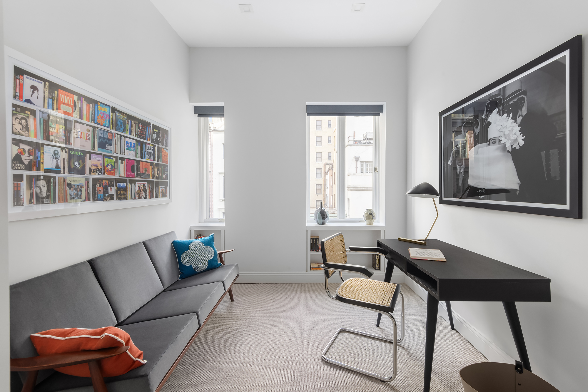 130 East 38th Street Manhattan, NY 10016 - Photo 13 of 16 a living room with furniture and a window