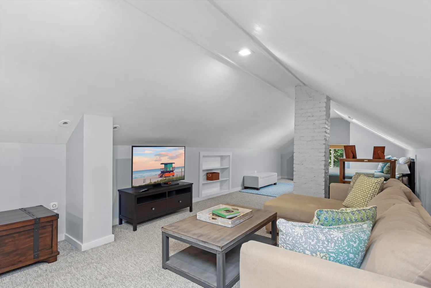 a bedroom with a bed and a couch