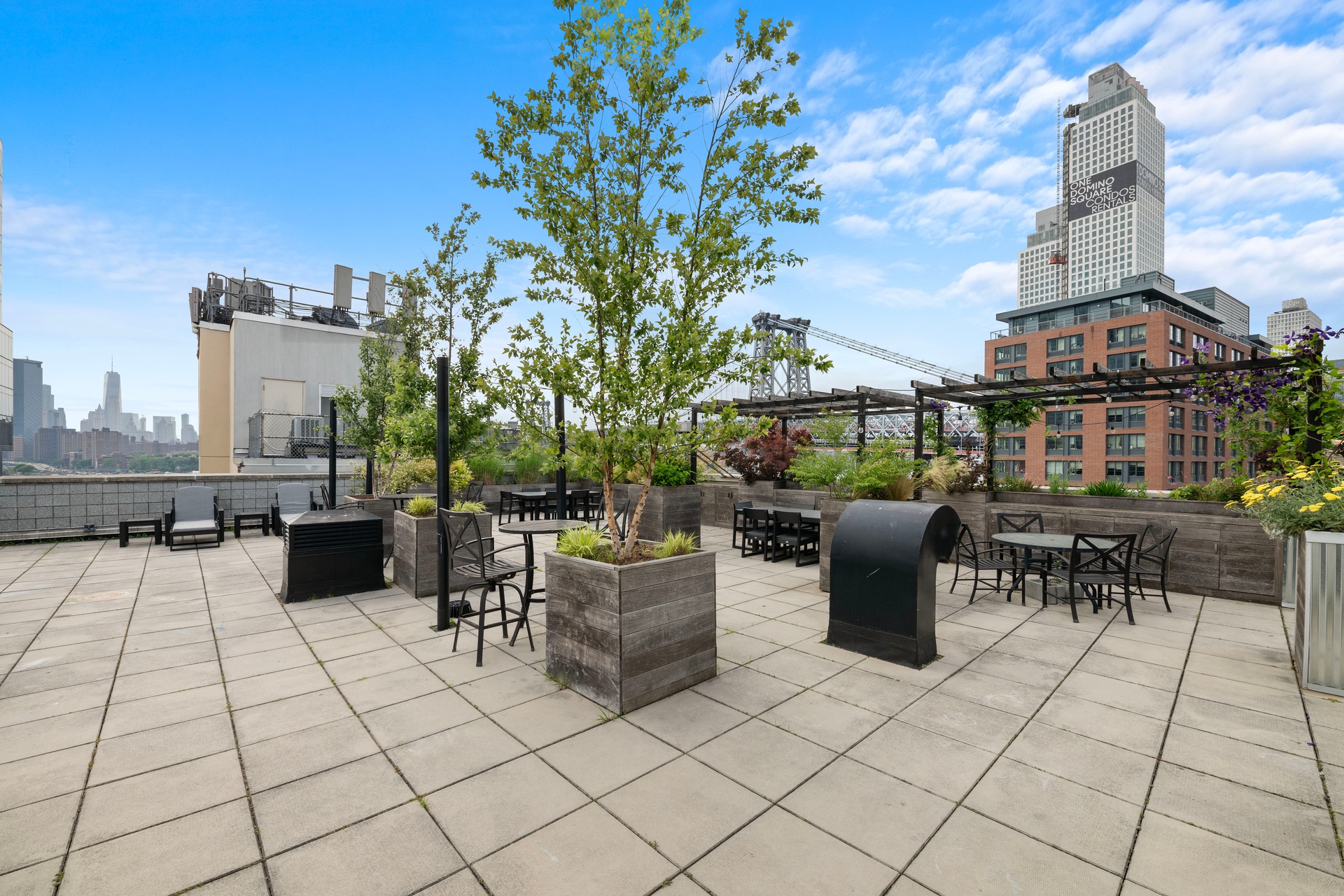 26 Broadway, Unit 602 Brooklyn, NY 11249 - Photo 9 of 12 a view of a terrace with furniture