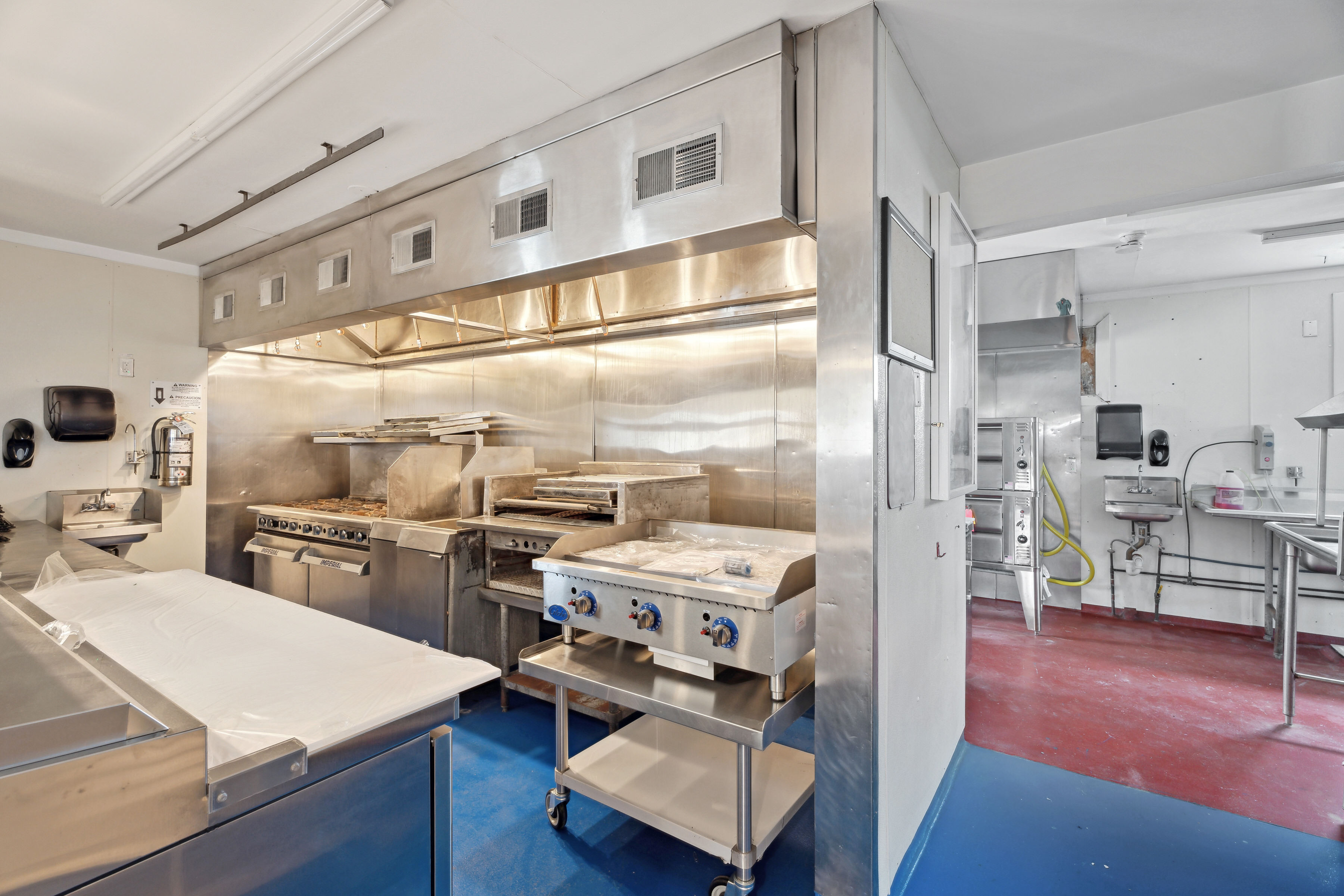 363 Beach Road Hampton Bays, NY 11959 - Photo 22 of 26 a kitchen with a sink appliances and wooden floor