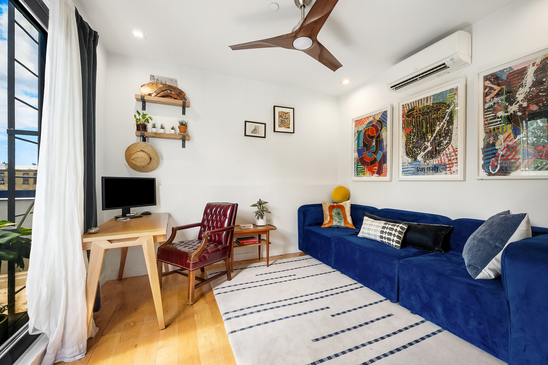 26 Eldert Street, Unit 4 Brooklyn, NY 11207 - Photo 6 of 10 a living room with furniture and wooden floor