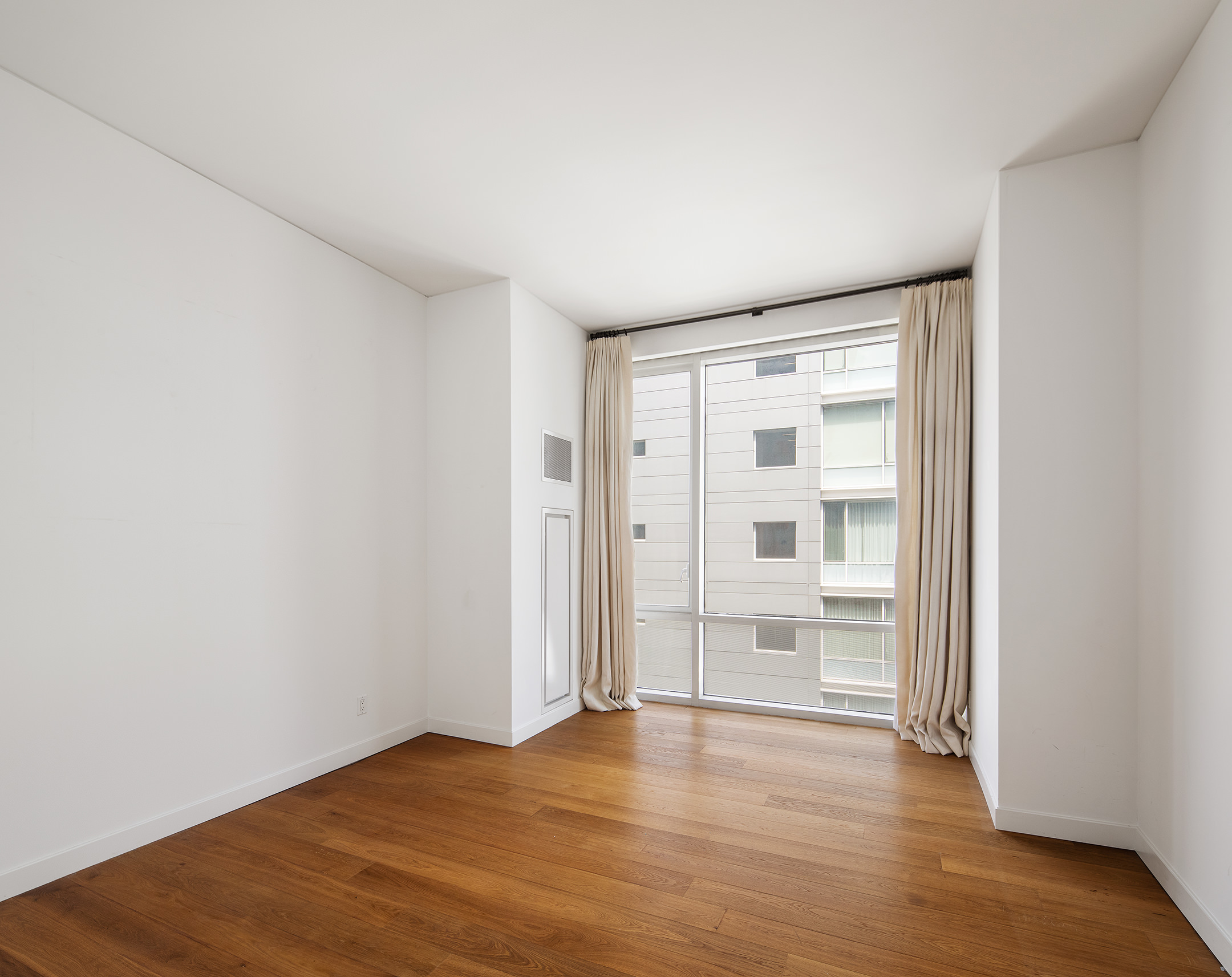 311 West Broadway, Unit 6J Manhattan, NY 10013 - Photo 12 of 19 wooden floor in an empty room