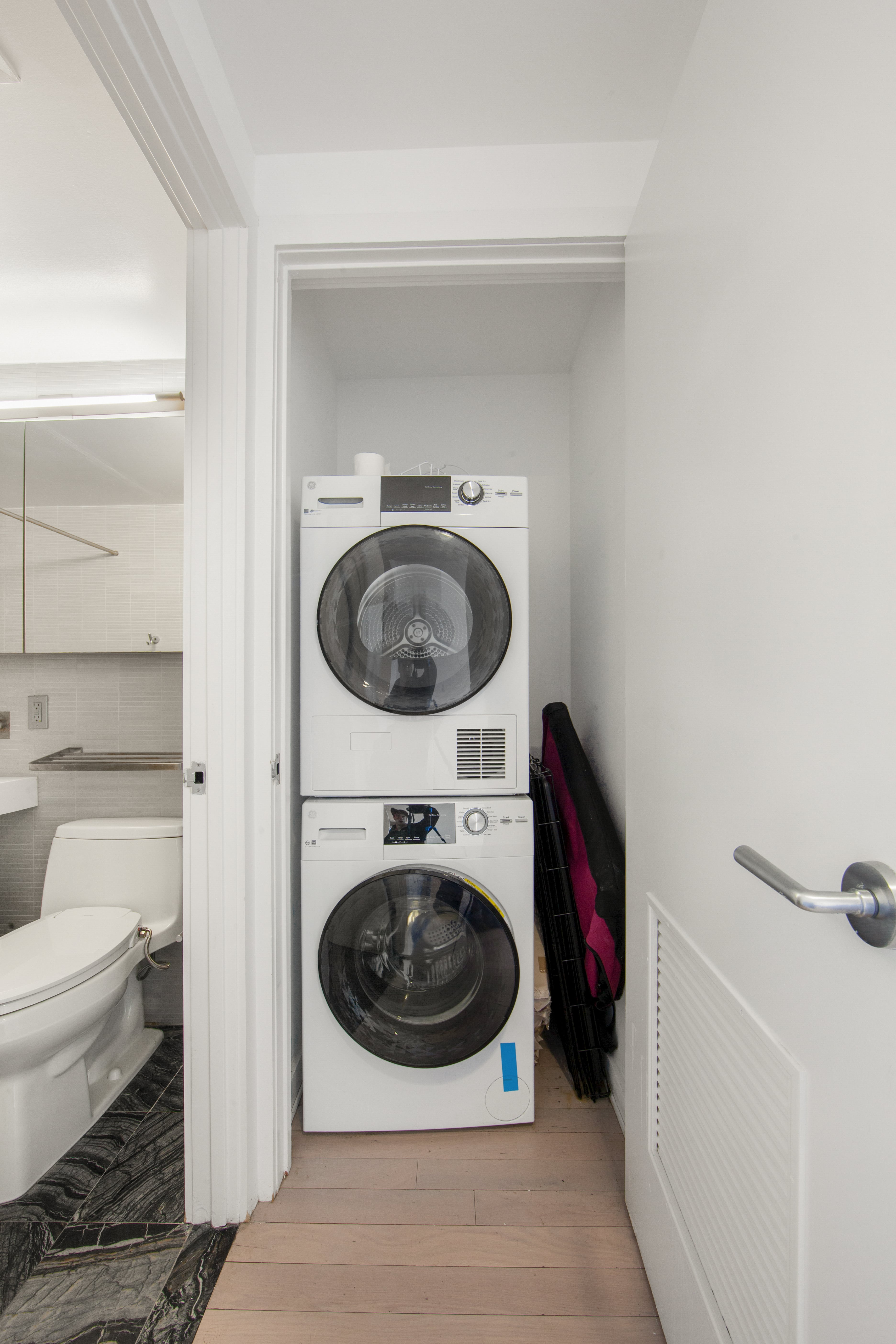 250 Bedford Avenue, Unit 129203 Brooklyn, NY 11249 - Photo 6 of 8 a utility room with dryer and washer