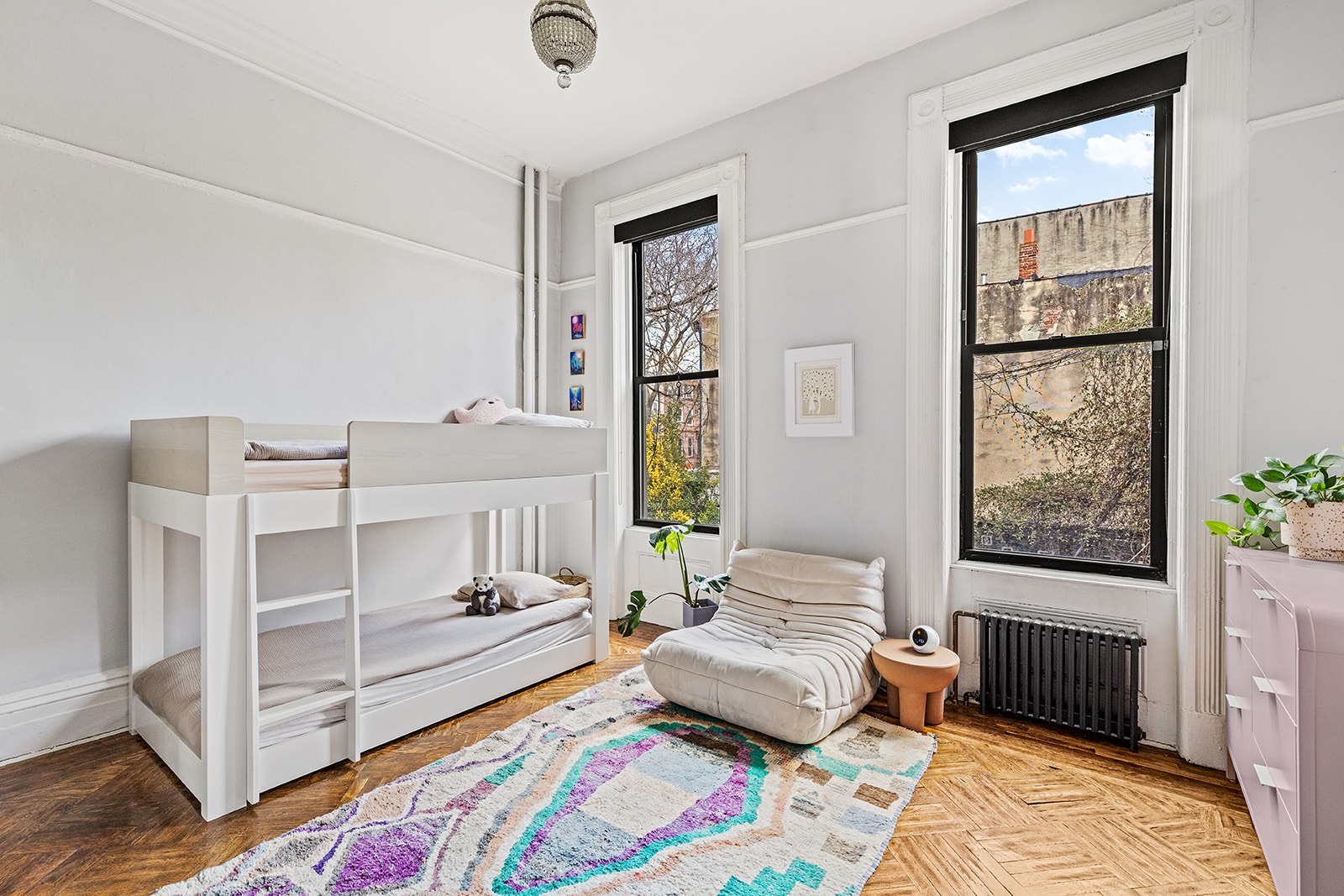 331 A Stuyvesant Avenue Brooklyn, NY 11233 - Photo 11 of 21 a bedroom with a bed and a window