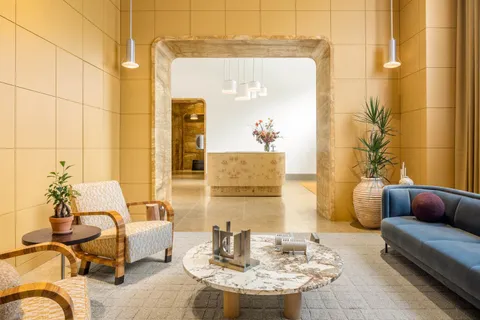 a living room with furniture and a table