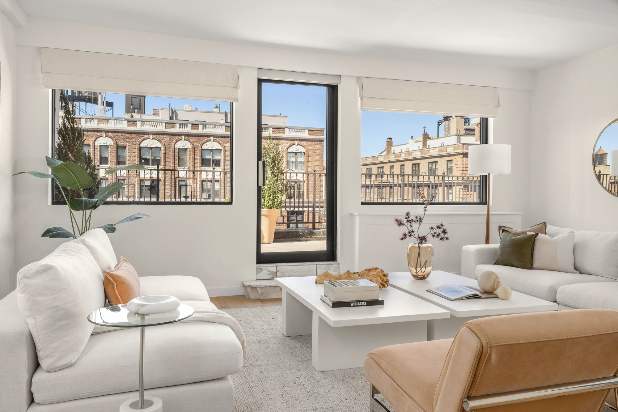 1049 Park Avenue, Unit PH Manhattan, NY 10028 - Photo 2 of 22 a living room with furniture flowerpot and a window
