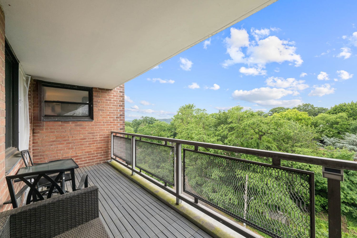 a view of balcony with furniture