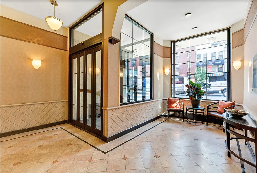 170 West 23rd Street, Unit 2F Manhattan, NY 10011 - Photo 9 of 10 a view of livingroom with furniture and a window
