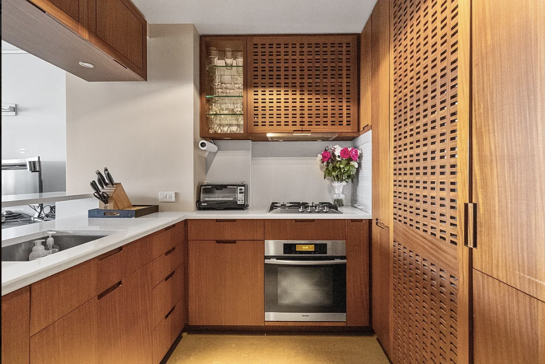 1 Irving Place, Unit G19D Manhattan, NY 10003 - Photo 4 of 6 a kitchen with stainless steel appliances granite countertop a stove and a sink