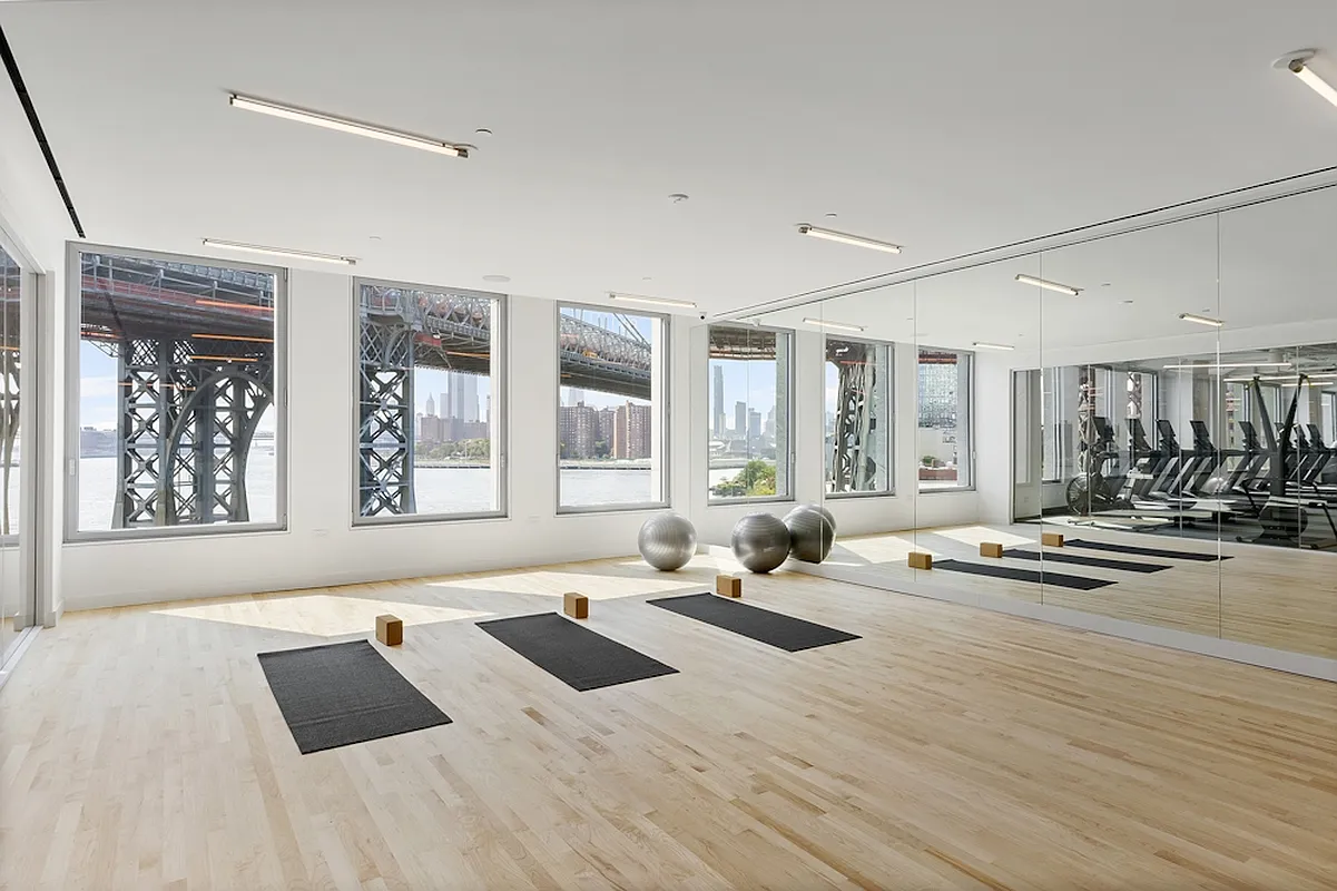 5 South 5th Street, Unit PH2B Brooklyn, NY 11249 - Photo 22 of 27 a living room with furniture window and a table