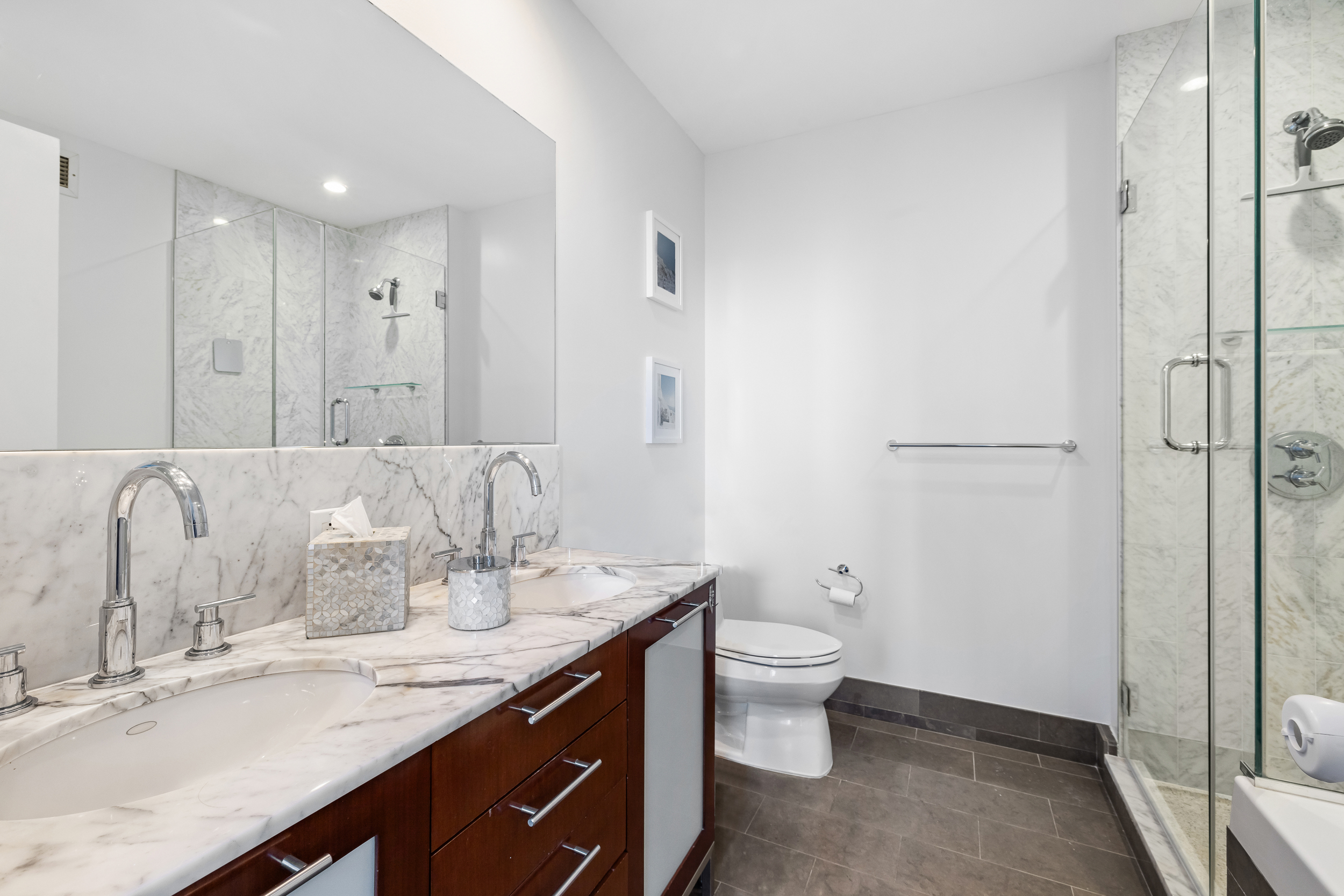100 Jay Street, Unit 15C Brooklyn, NY 11201 - Photo 10 of 19 a spacious bathroom with a granite countertop sink a toilet and shower