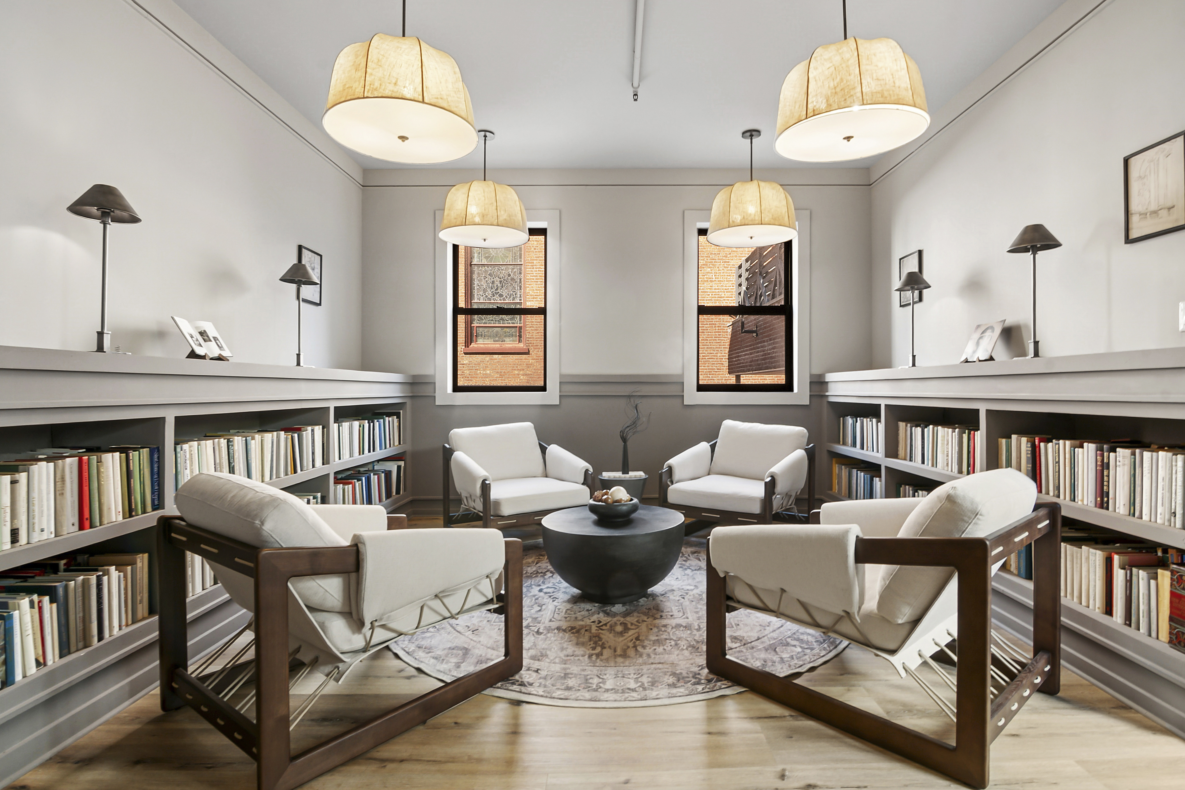 180 Bainbridge Street, Unit 111 Brooklyn, NY 11233 - Photo 15 of 25 a living room with furniture and a book shelf