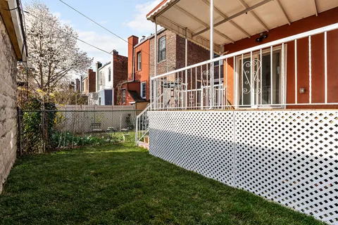 a view of a house with a wooden deck