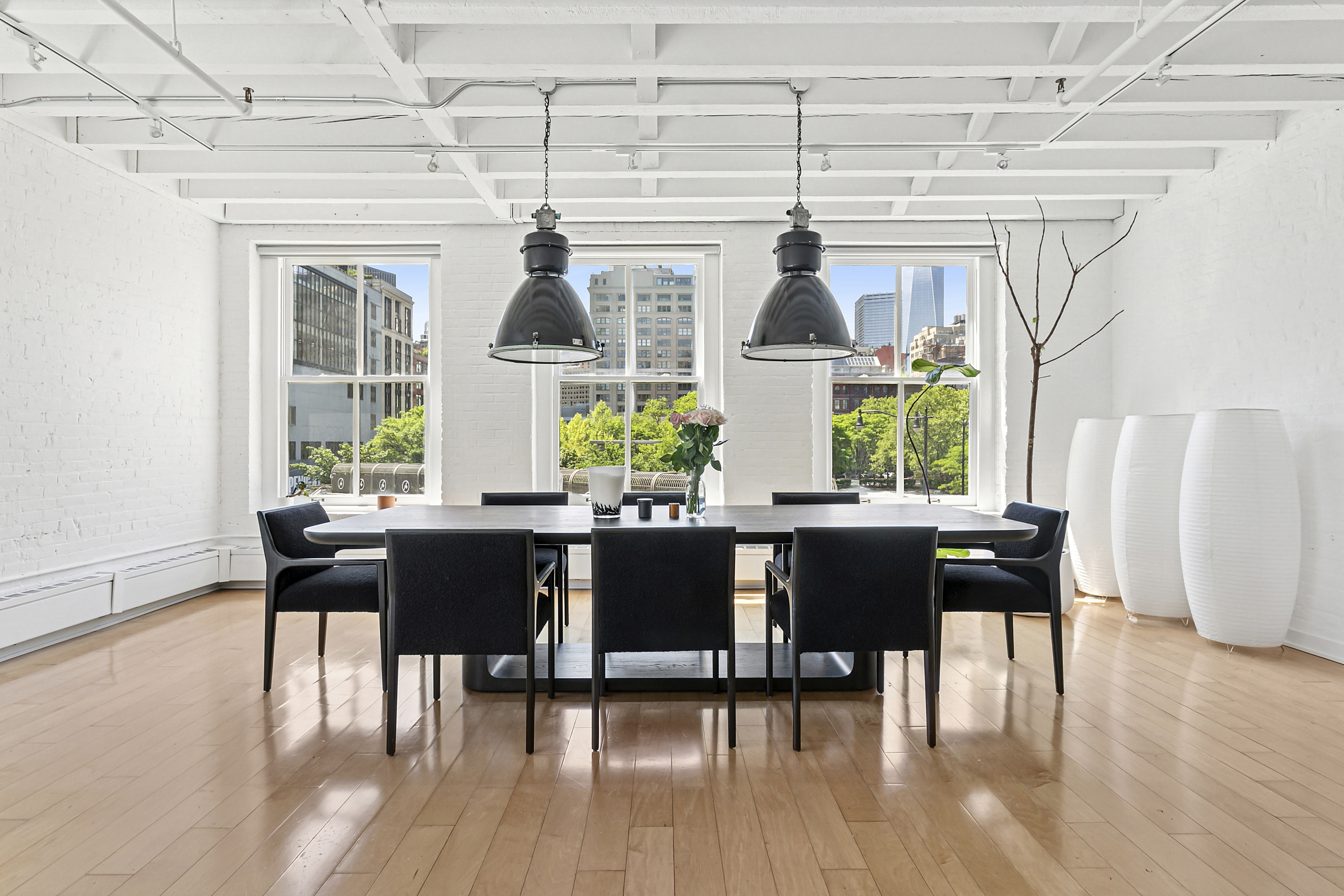 28 Laight Street, Unit 3B Manhattan, NY 10013 - Photo 2 of 11 a view of a dining room with furniture and wooden floor
