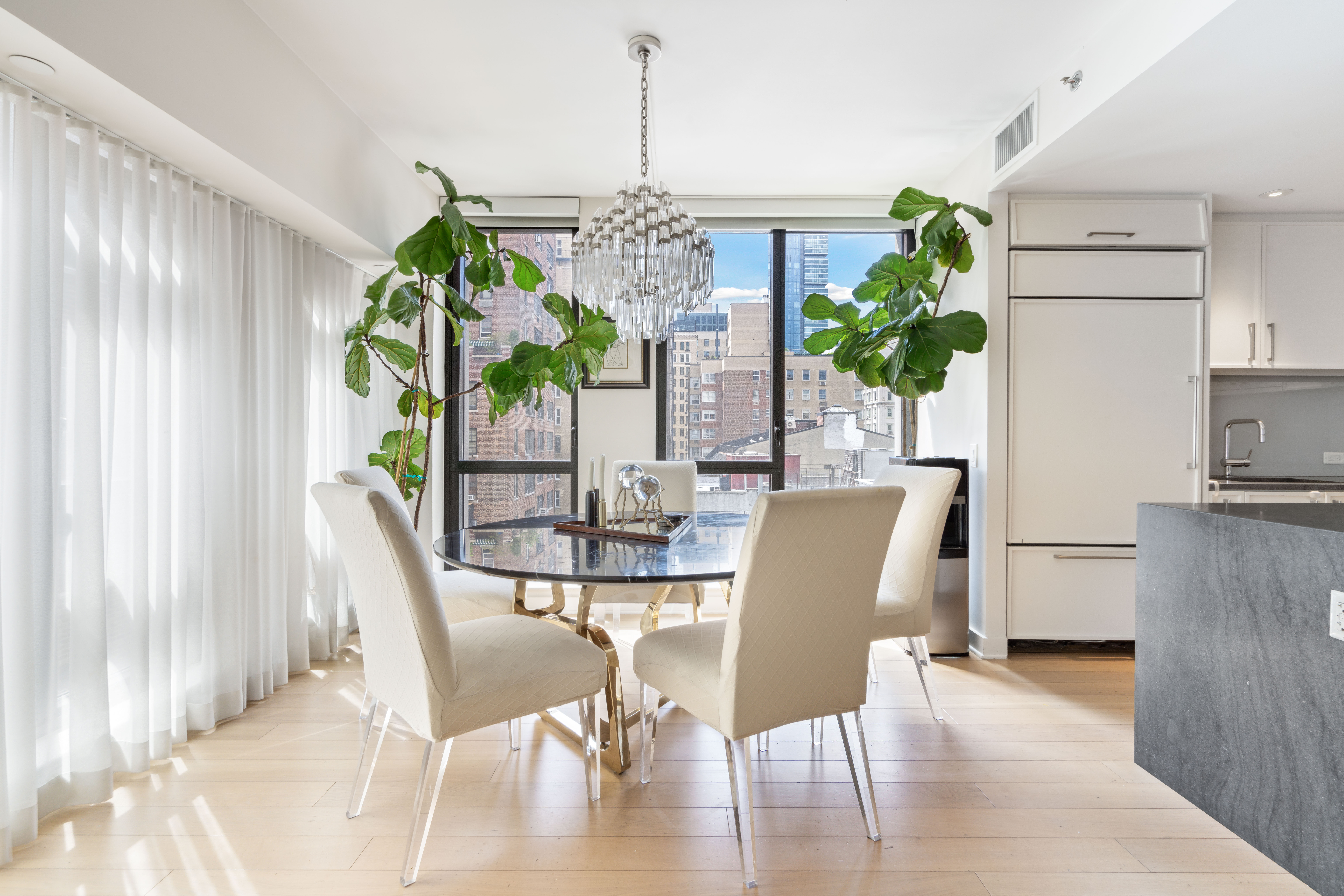160 East 22nd Street, Unit 9E Manhattan, NY 10010 - Photo 3 of 17 a view of a dining room with furniture window and wooden floor