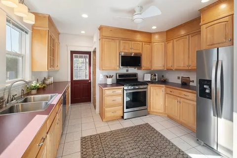 a kitchen with a sink stove and refrigerator