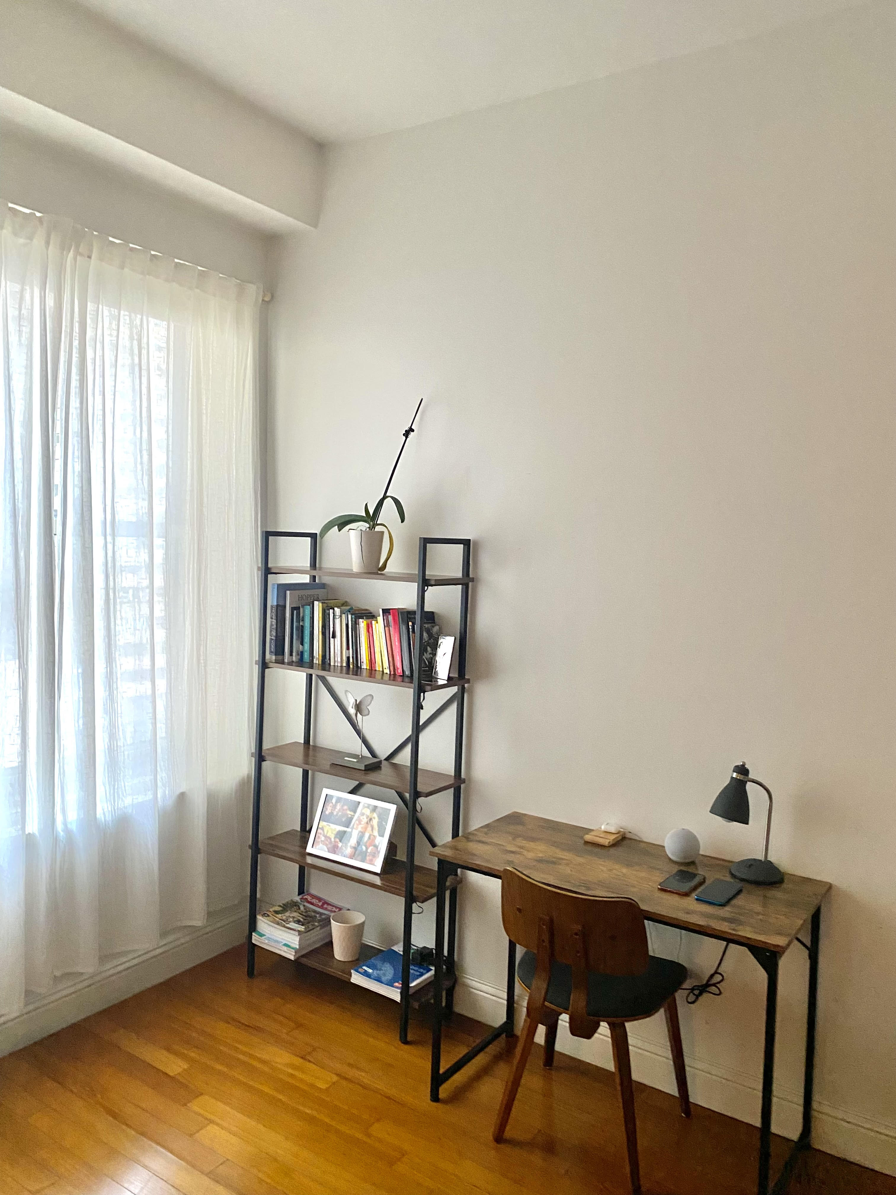 88 Greenwich Street, Unit 1218 Manhattan, NY 10006 - Photo 4 of 30 a view of a workspace with furniture and a window