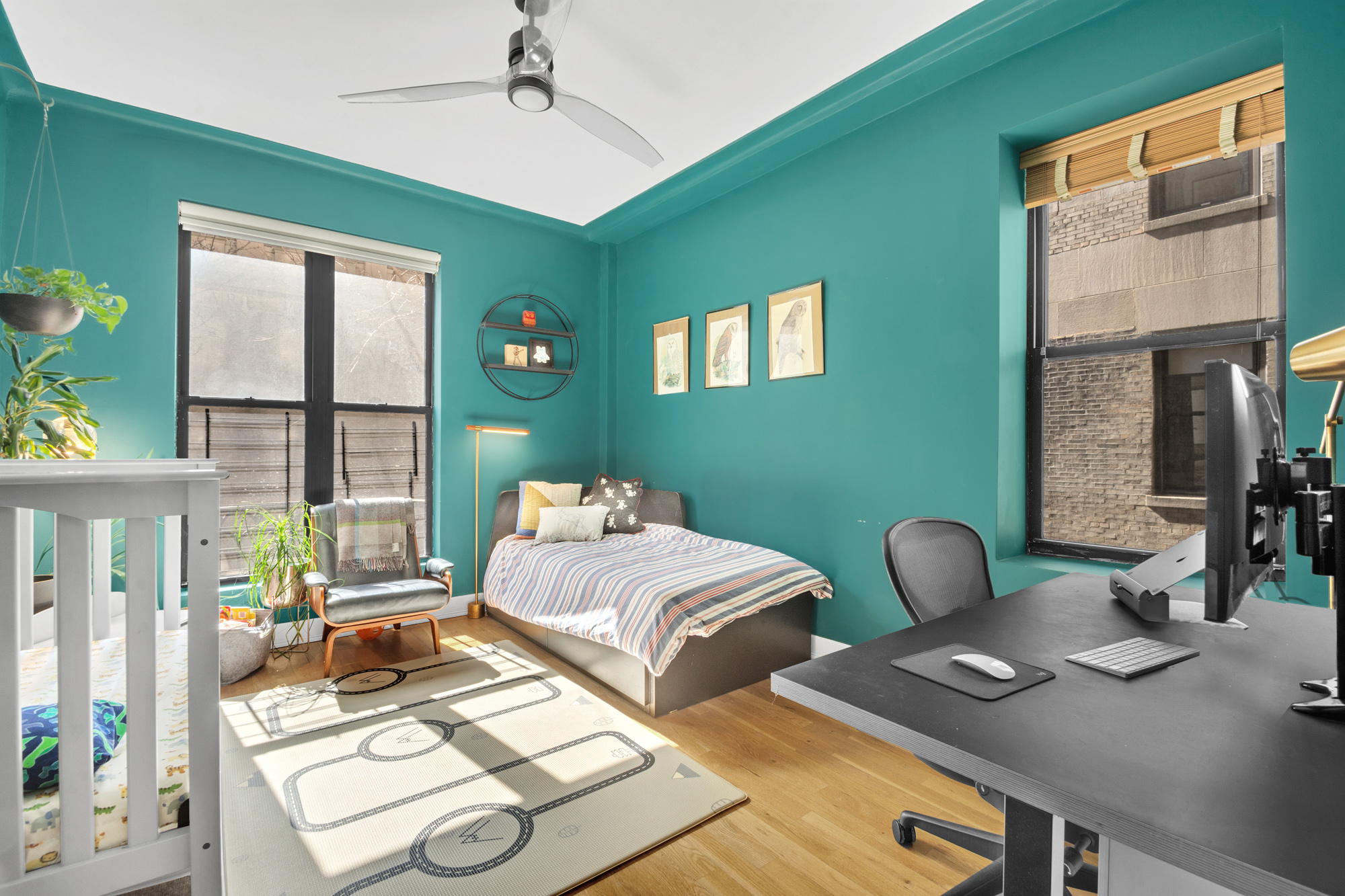 790 Riverside Drive, Unit 2LX Manhattan, NY 10032 - Photo 8 of 10 a bedroom with furniture and a window