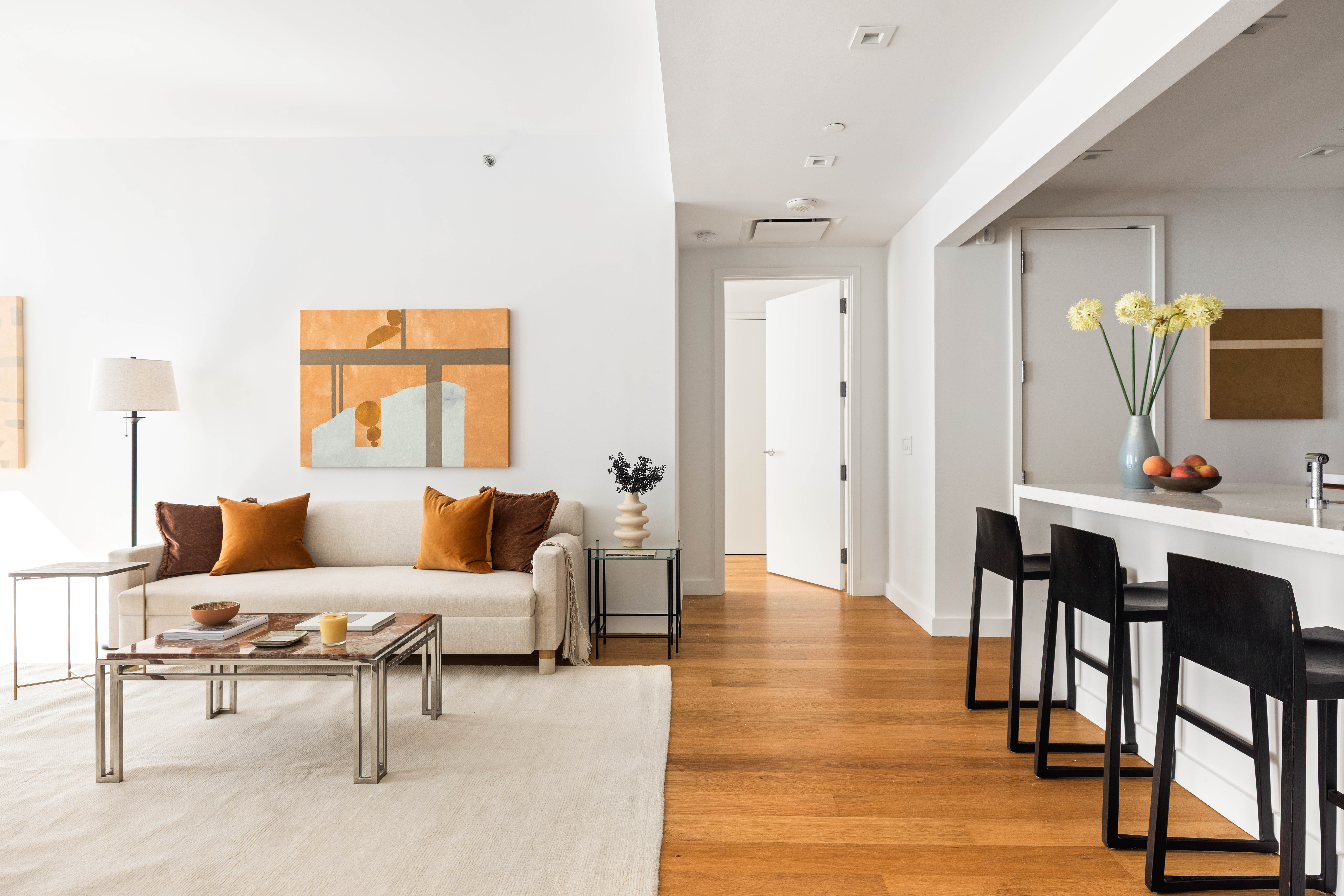 360 East 89th Street, Unit 5D Manhattan, NY 10128 - Photo 1 of 13 a living room with furniture and wooden floor