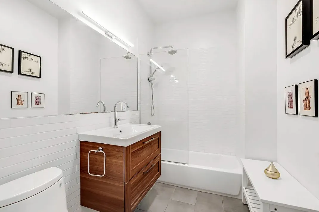 a bathroom with a sink toilet and bathtub