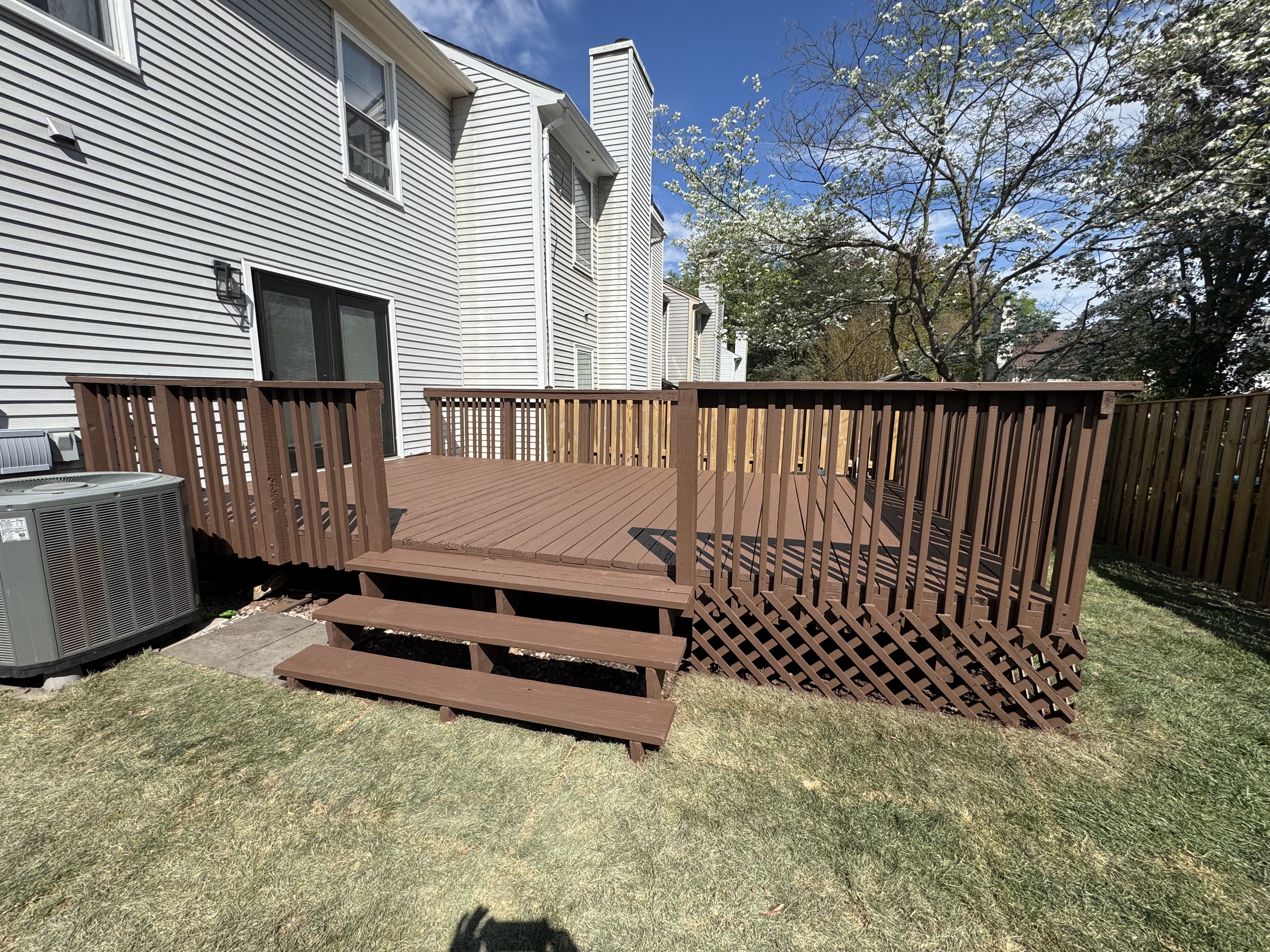 7265 Kousa Lane Springfield, VA 22152 - Photo 4 of 11 a view of barbeque grill with wooden fence