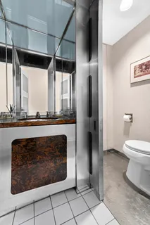 a bathroom with a sink a toilet and a shower