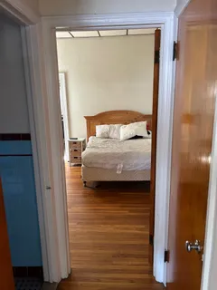 a bedroom with a bed and a mirror