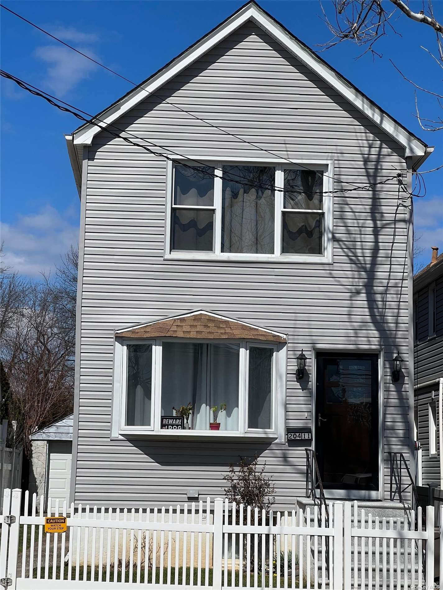 204-11 46th Avenue Queens, NY 11361 - Photo 1 of 7 a front view of a house