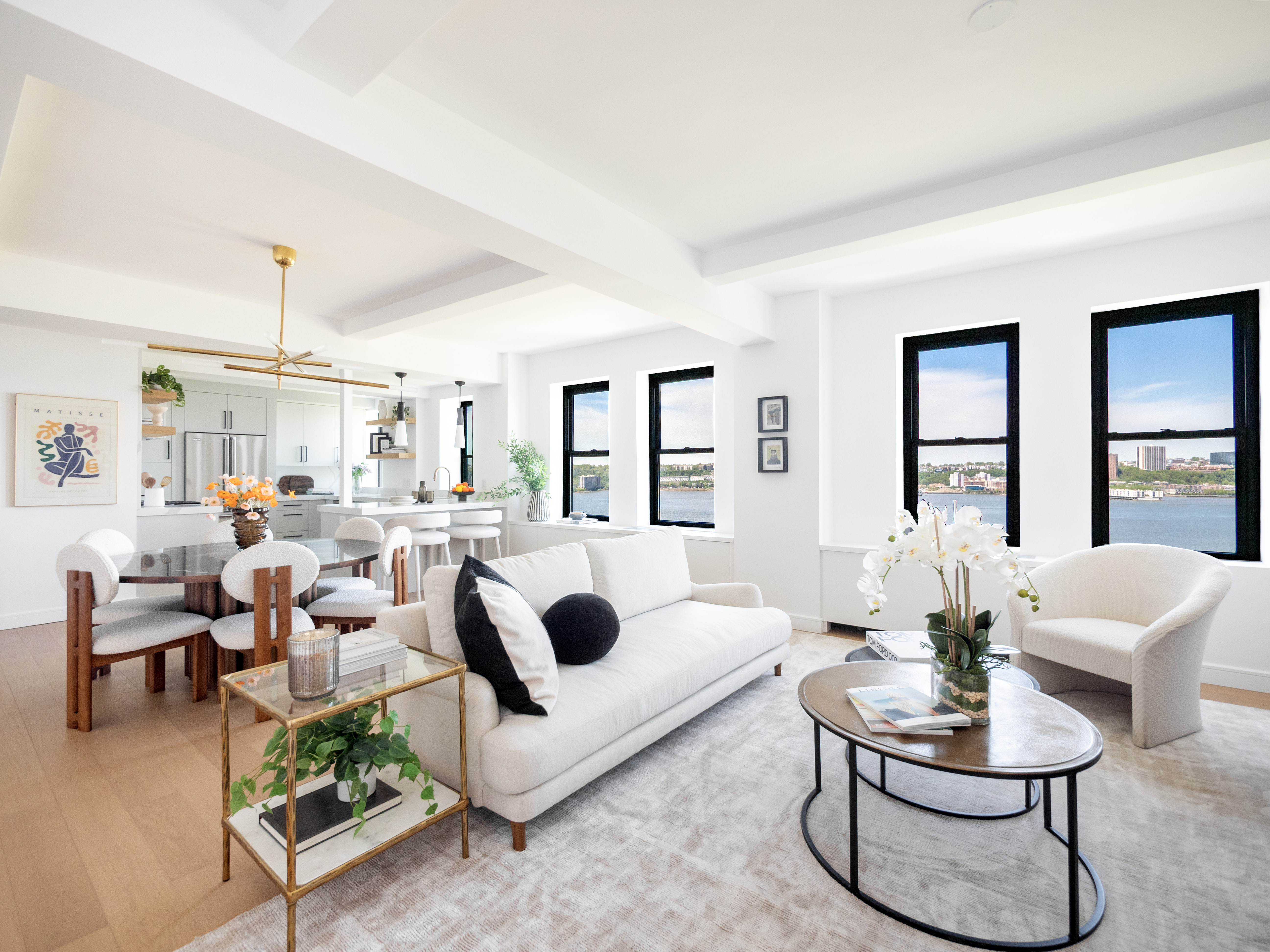 230 Riverside Drive, Unit 14AC Manhattan, NY 10025 - Photo 1 of 30 a living room with furniture and a dining table with wooden floor