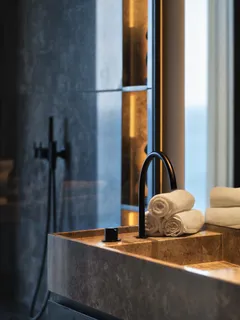 a living room with furniture and a lamp