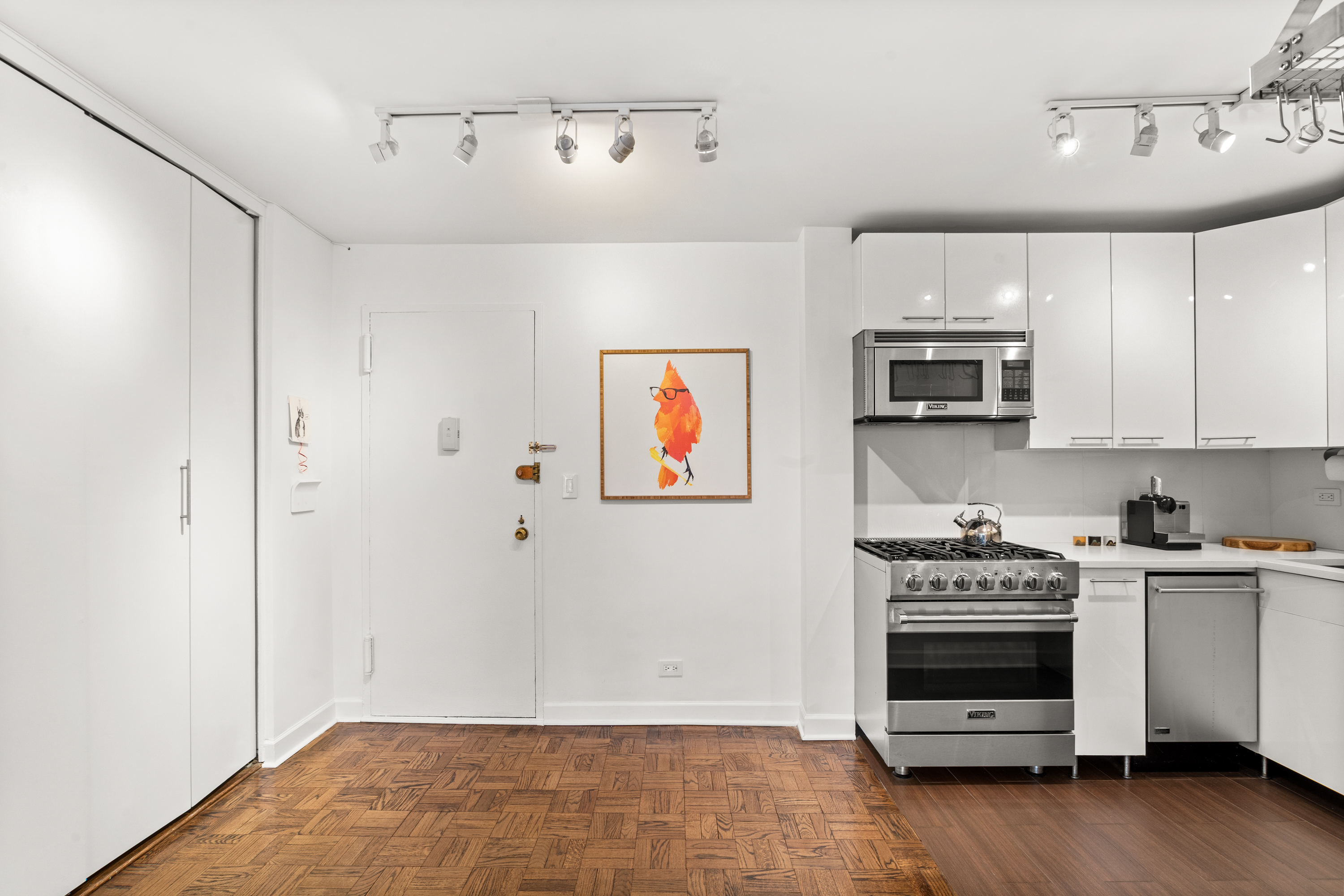 251 East 51st Street, Unit 5A Manhattan, NY 10022 - Photo 10 of 23 a view of kitchen with microwave and stove