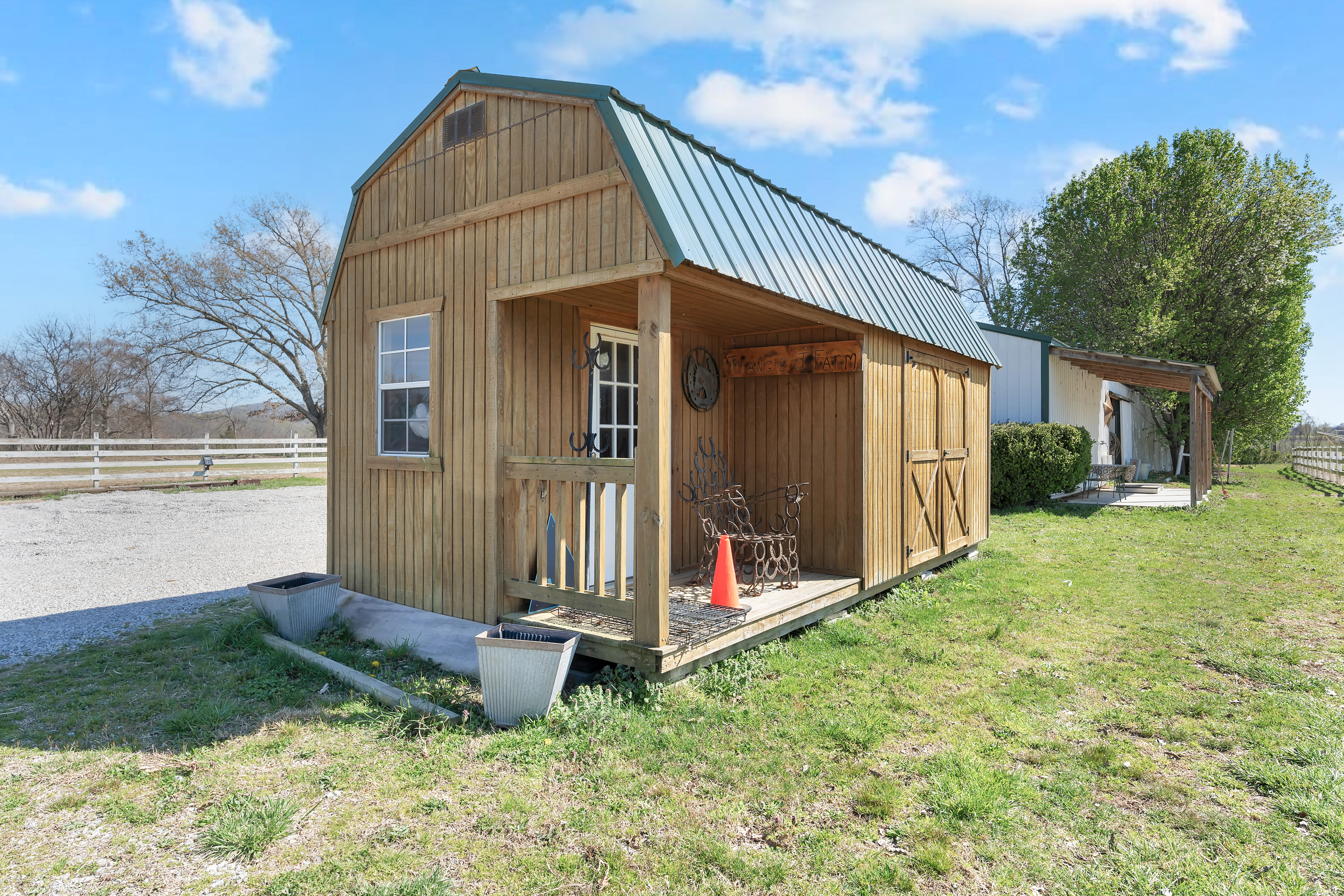 2073 Harpo Road Manchester, TN 37355 - Photo 43 of 45 a view of a small house with yard and sitting area
