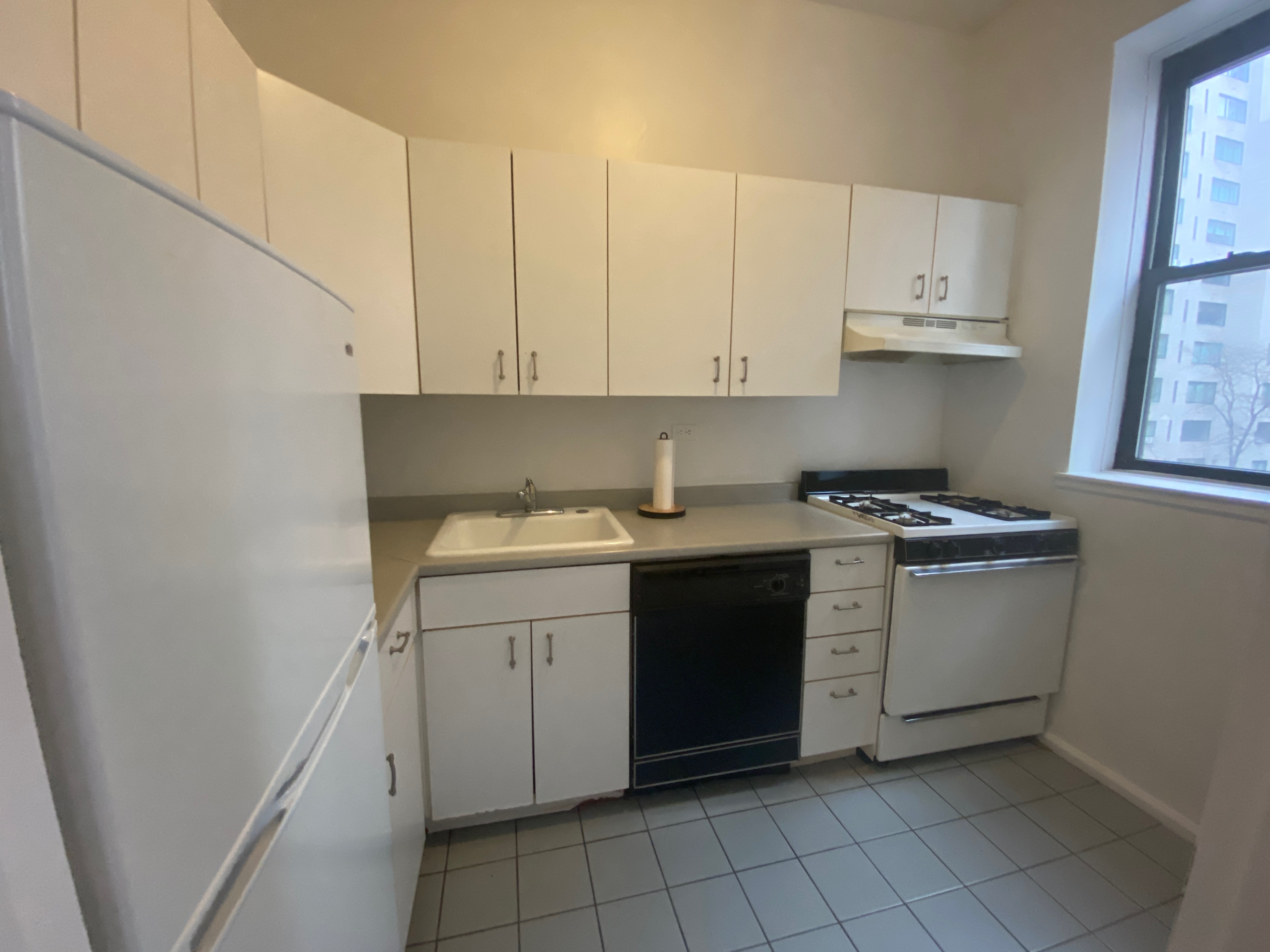 1240 Lexington Avenue, Unit 34 Manhattan, NY 10028 - Photo 2 of 11 a kitchen with a sink and cabinets