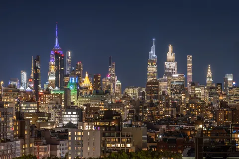 a view of a city with tall buildings