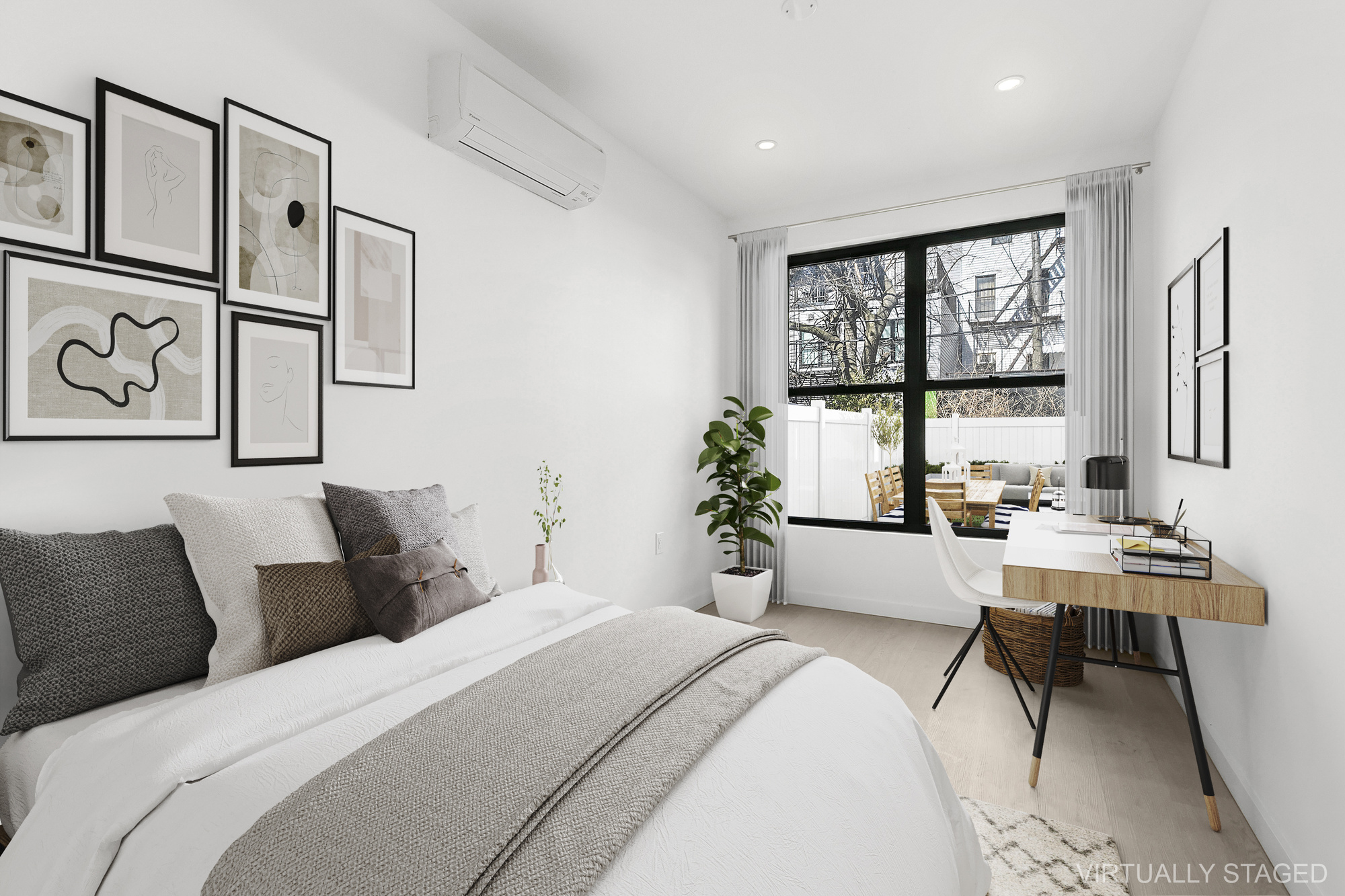 647 Dekalb Avenue, Unit 1B Brooklyn, NY 11216 - Photo 6 of 9 a bedroom with a large bed and a window