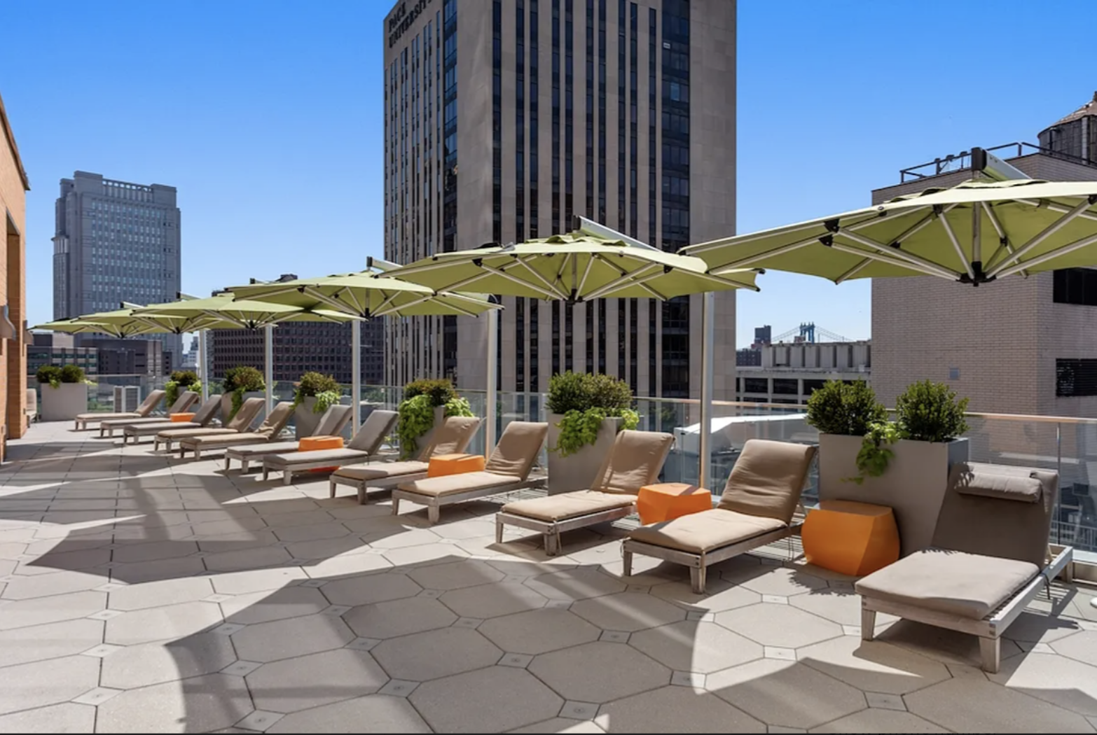 Spruce Street, Unit 12A Manhattan, NY 10038 - Photo 7 of 18 a view of a patio with a table and chairs under an umbrella