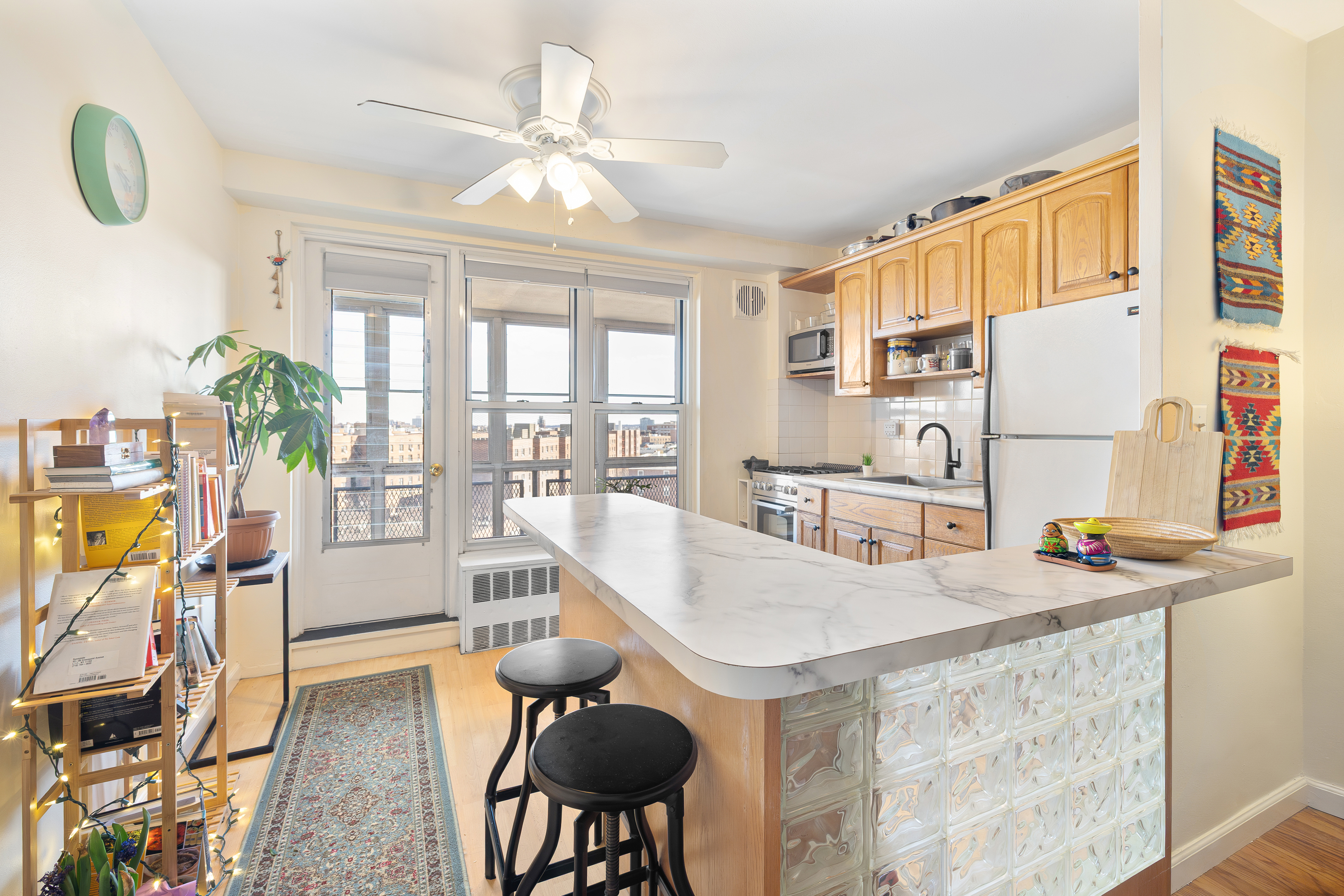 35-51 85th Street, Unit 9N Queens, NY 11372 - Photo 3 of 10 a dining room with furniture and floor to ceiling window