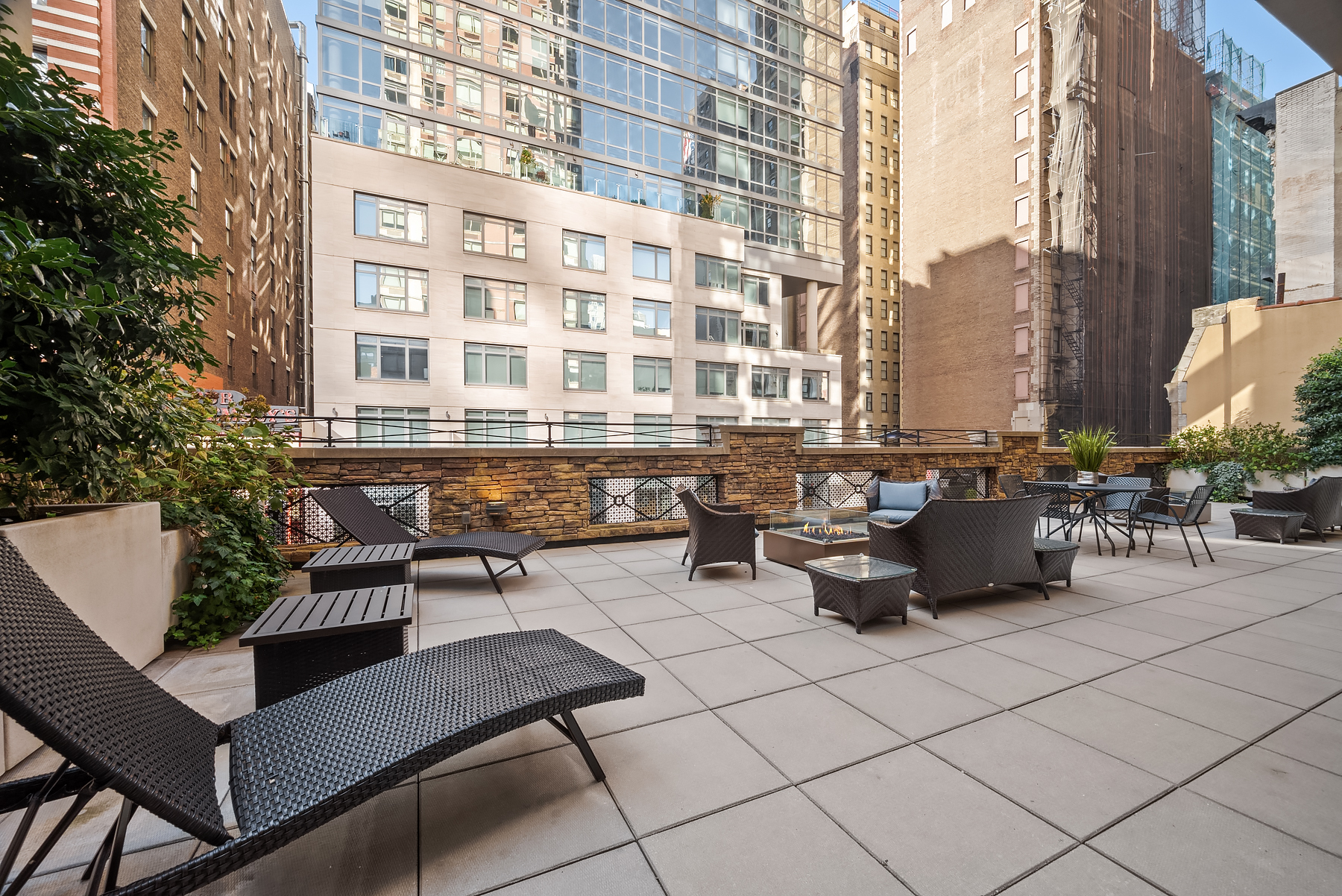 35 West 33rd Street, Unit 28D Manhattan, NY 10001 - Photo 15 of 28 a roof deck with table and chairs