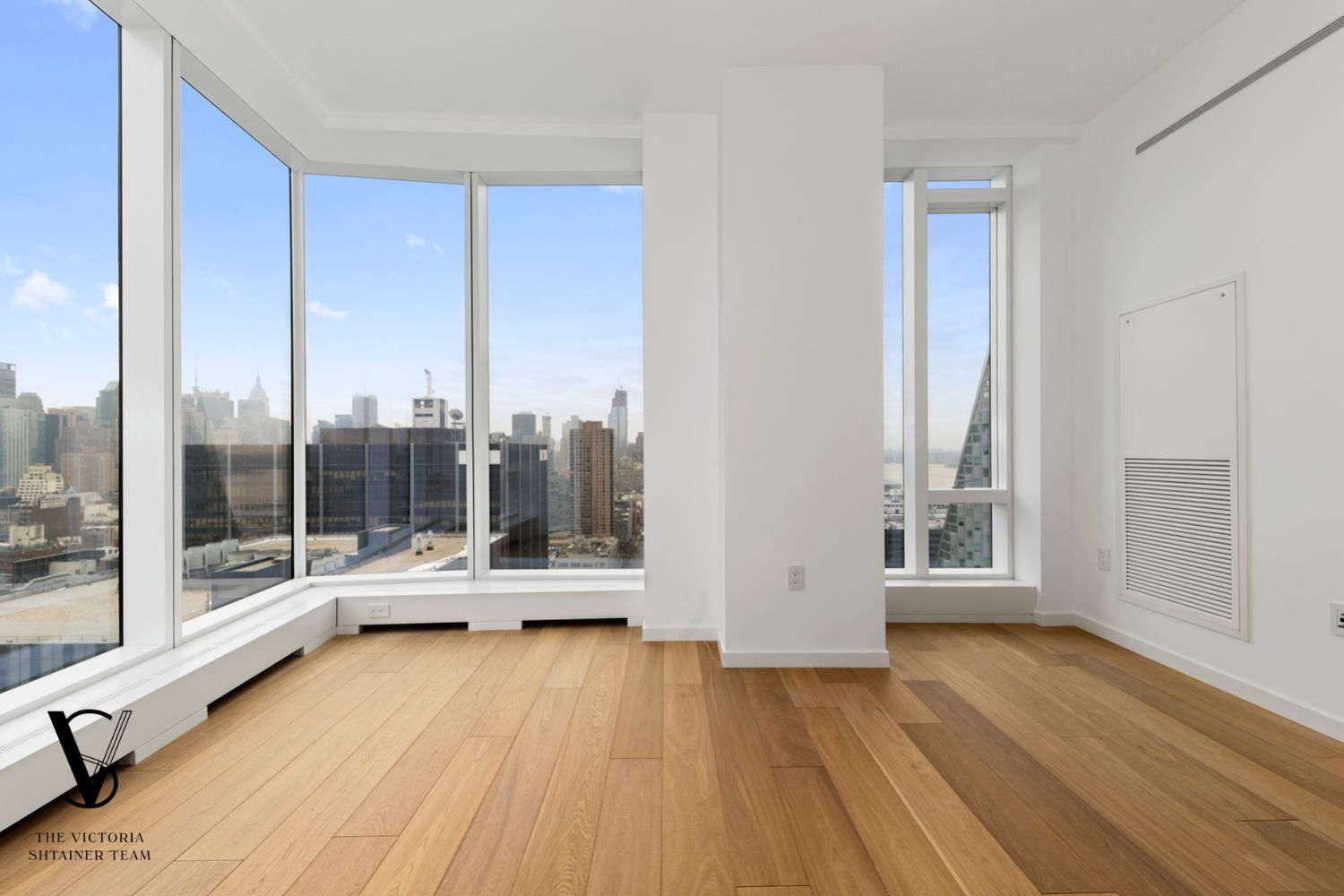 1 West End Avenue, Unit C28 Manhattan, NY 10069 - Photo 7 of 26 a view of a living room with floor to ceiling window and wooden floor