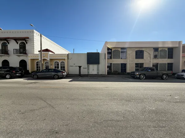 a view of a car park in front of house