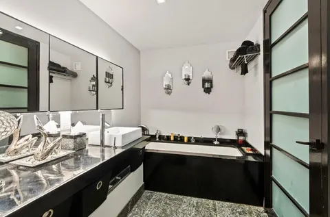 a bathroom with a sink and a mirror