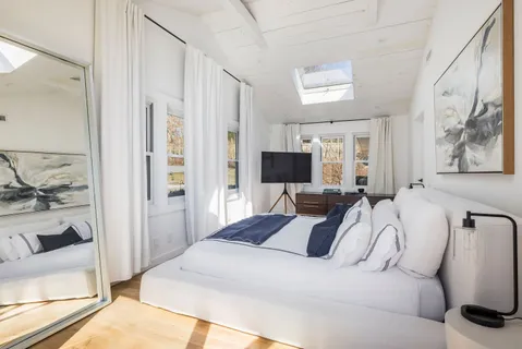 a bedroom with a bed and a couch