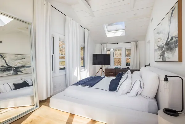 a bedroom with a bed and a couch