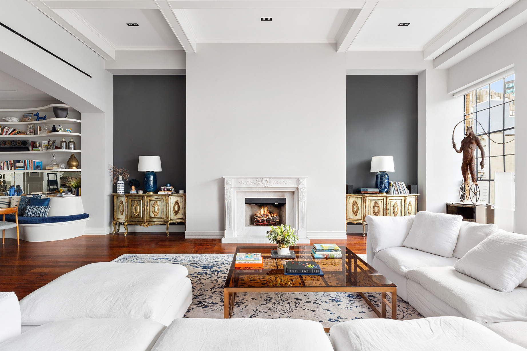 73 Wooster Street, Unit PHA Manhattan, NY 10012 - Photo 5 of 25 a living room with furniture and a fireplace