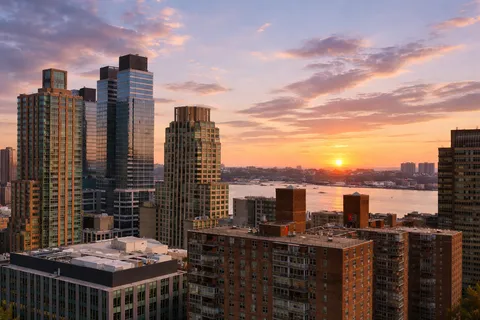 a view of a city with tall buildings