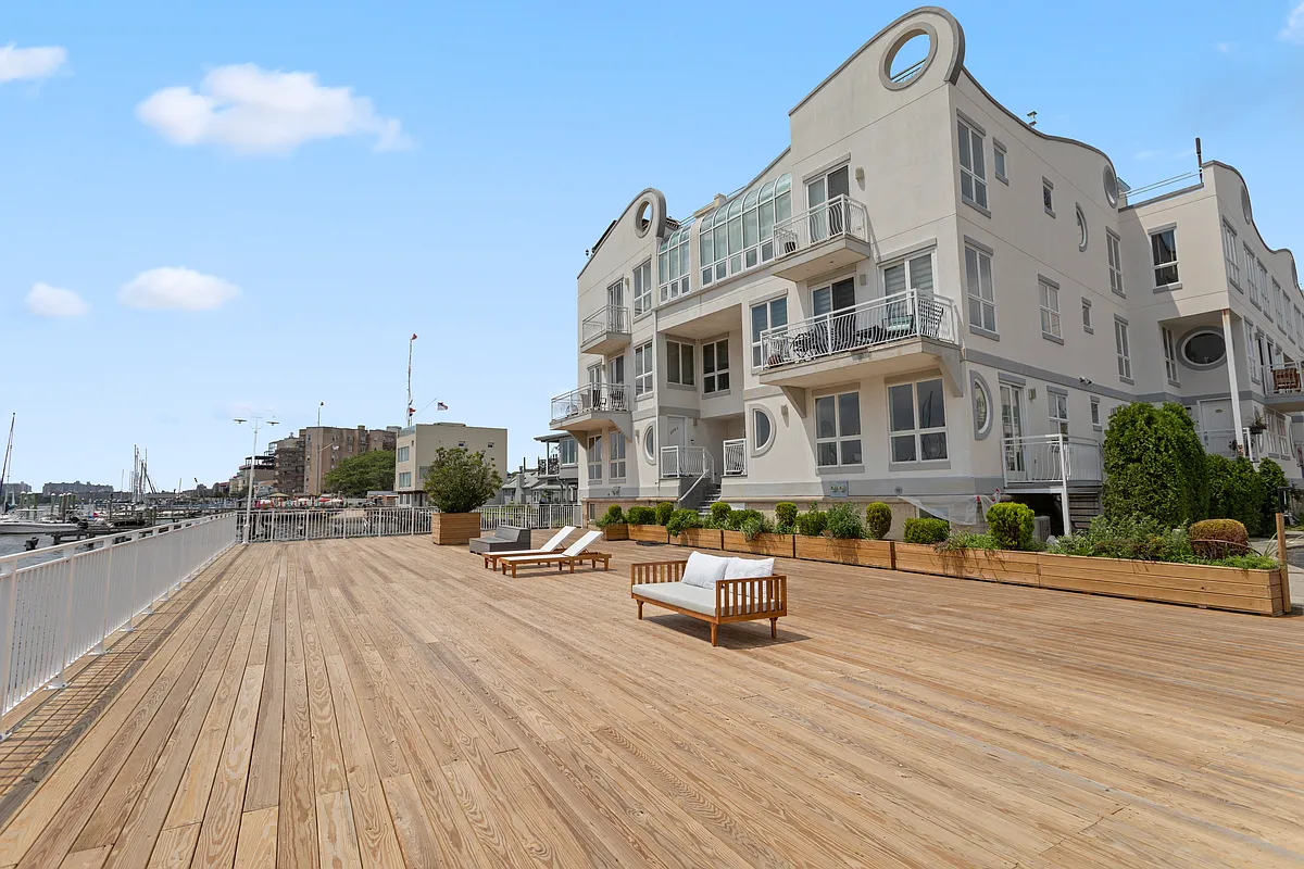 3144 Emmons Avenue, Unit 102 Brooklyn, NY 11235 - Photo 8 of 12 a view of a building with sitting area