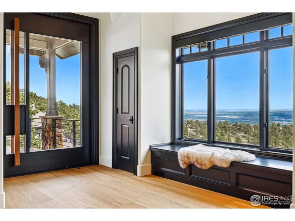 a bedroom with furniture and large window