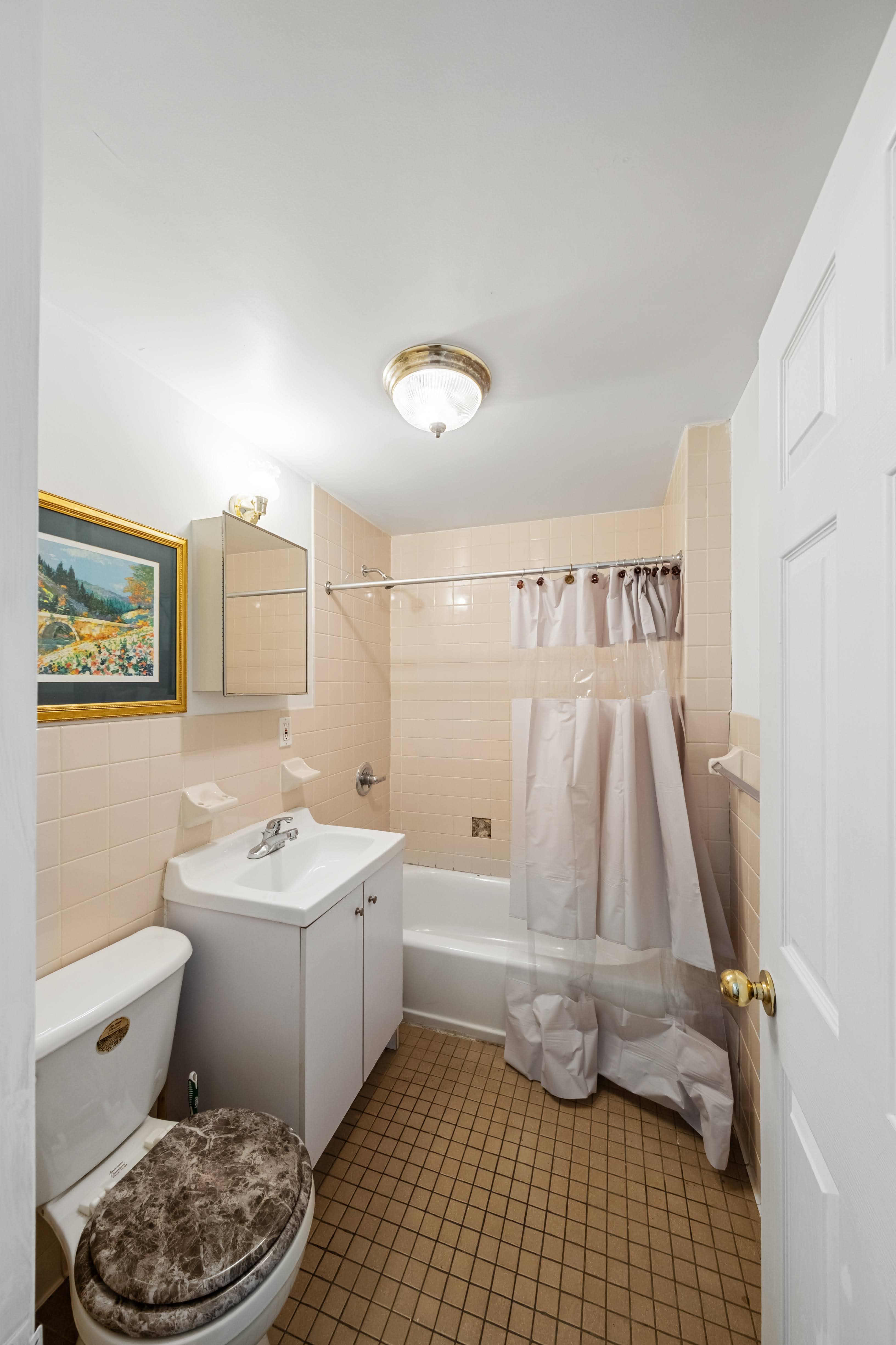 275 Van Buren Street Brooklyn, NY 11221 - Photo 23 of 33 a bathroom with a sink toilet and shower